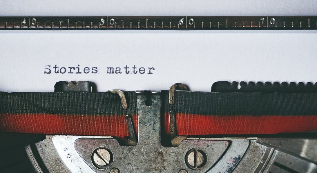 Type writer typing 'stories matter'